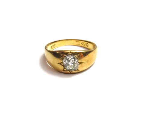 An 18ct gold and diamond set single stone ring, star gypsy set, with a cushion shaped diamond, Chester 1882, ring size Q and 