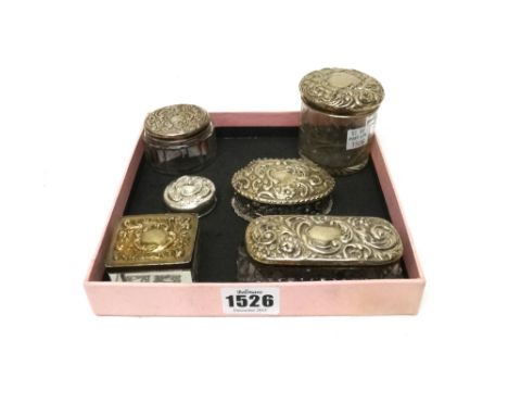 Silver and silver mounted wares, comprising; a shaped oval hinge lidded trinket box with embossed decoration, Birmingham 1903
