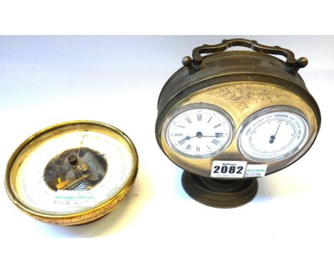 A gilt metal clock/barometer desk compendium, early 20th century, the oval plate engraved with flowers, enclosing two enamel 