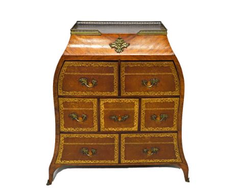 A late 19th century French gilt metal mounted walnut cartonnier of tapering form, the galleried top over seven gilt tooled le