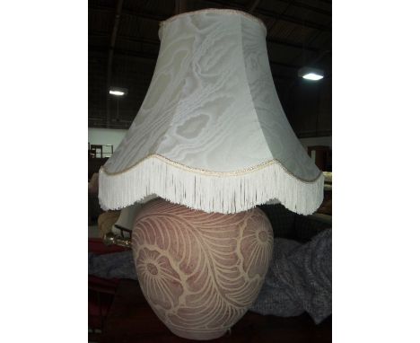 A large 20th century bulbous pottery table lamp.