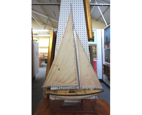 A vintage wooden pond yacht, 'White Spray', with white and green painted hull and lead keel, on a mahogany base, 62cm wide x 