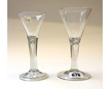 An English wine glass, circa 1750, with drawn trumpet bowl over a plain stem with an air bubble inclusion, on a folded foot, 