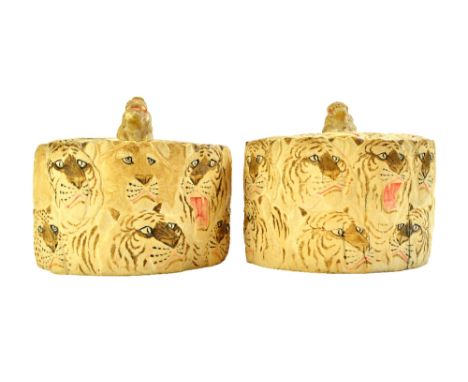 A pair of Japanese ivory tusk boxes and covers, Meiji period, each carved in low relief and picked out in colours with lion a