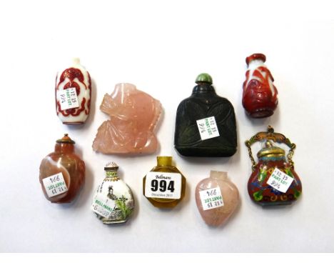 A group of eight Chinese snuff bottles, 19th/20th century, comprising; two rose quartz examples; two red overlay bottles; a f