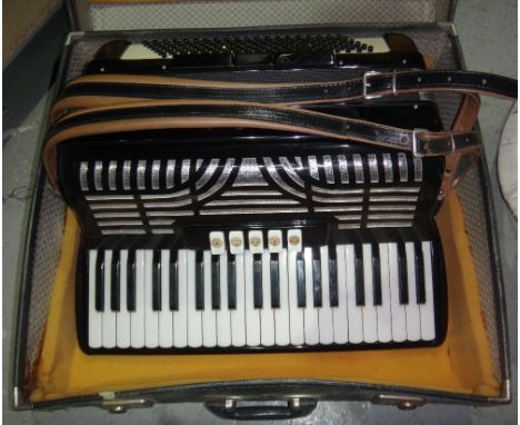 A cased 'Orla' accordion.