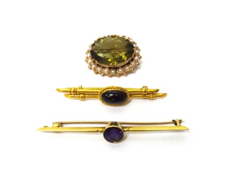 A gold, pale olive green quartz and cultured pearl set oval brooch, claw set with the oval cut olive green quartz at the cent