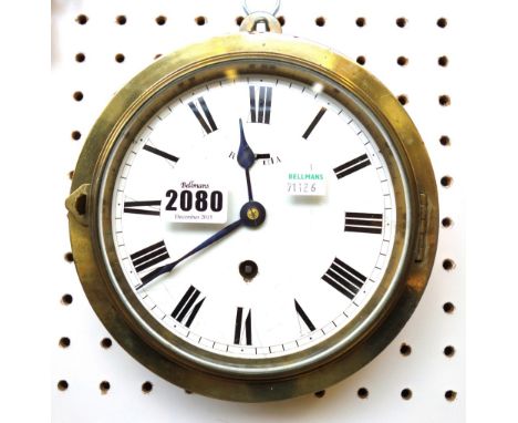 A brass cased dial clock, late 19th century, with white enamel dial and single train movement, 19cm diameter. 