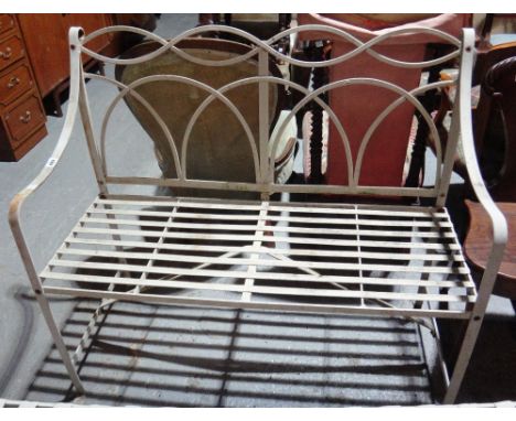 A 20th century Regency style white painted metal garden bench.