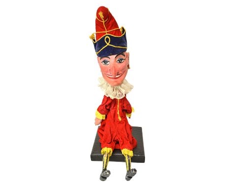 A quantity of vintage wood and papier mache puppets, circa 1960, from a Punch and Judy show, comprising; Punch, Judy, crocodi
