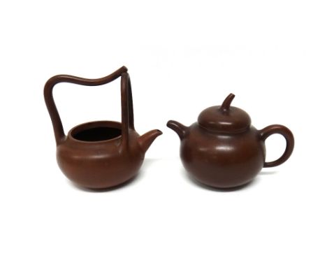 A Chinese Yixing teapot and cover, of gourd shaped with stalk finial, impressed mark to cover, 13cm. high; and another Yixing