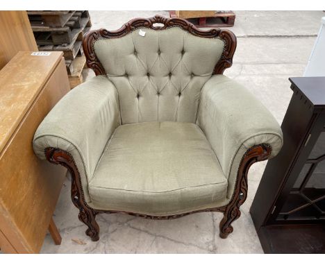 AN ITALIAN STYLE BUTTON-BACK FIRESIDE CHAIR 