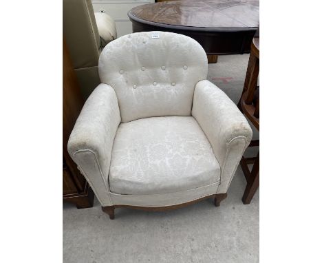 A SPRUNG AND UPHOLSTERED BUTTON-BACK TUB CHAIR 