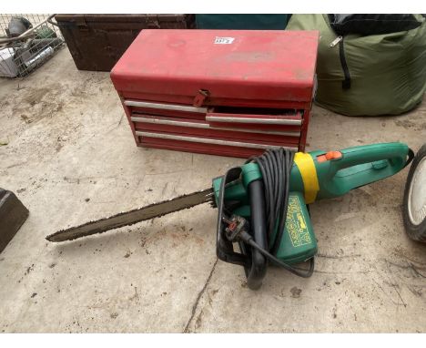 AN ELECTRIC CHAINSAW AND A METAL TOOL CHEST WITH AN ASSORTMENT OF TOOLS 