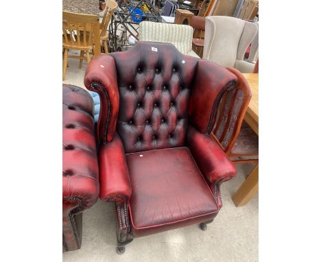 A MODERN OXBLOOD BUTTON-BACK WINGED FIRESIDE CHAIR, ON CABRIOLE LEGS 