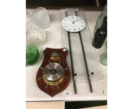 A CHROME AND GLASS WALL CLOCK 18CM X 62CM PLUS A MAHOGANY CASED BAROMETER 
