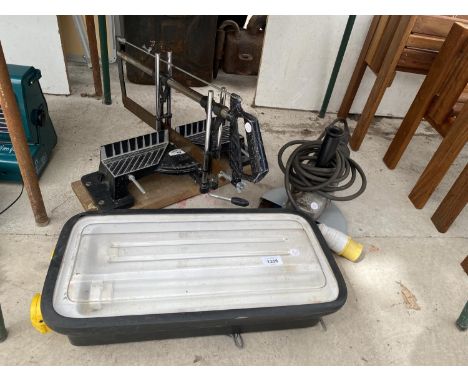 A 110V BOSCH ANGLE GRINDER, A LIGHT AND A MITRE SAW 