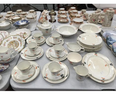 A PALISSY ART DECO TEASET TO INCLUDE TEAPOT, JUGS, SUGAR BOWL, CUPS, SAUCERS, PLATES, SERVING DISHES, ETC 