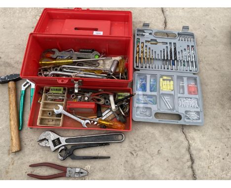 A TOOL BOX CONTAINING AN ASSORTMENT OF TOOLS TO INCLUDE SPANNERS, PLIERS AND DRILL BITS ETC 