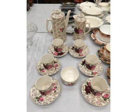 A BESWICK ROSE PATTERNED COFFEE SET WITH COFFEE POT, HOT WATER JUG, COFFEE CANS AND SAUCERS AND SUGAR BOWL 