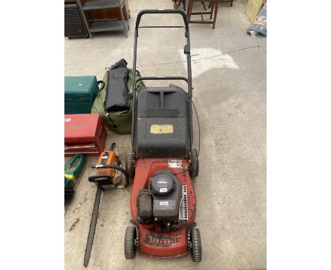 A CHAMPION LAWN MOWER WITH GRASS BOX AND BRIGGS AND STRATTON PETROL ENGINE 