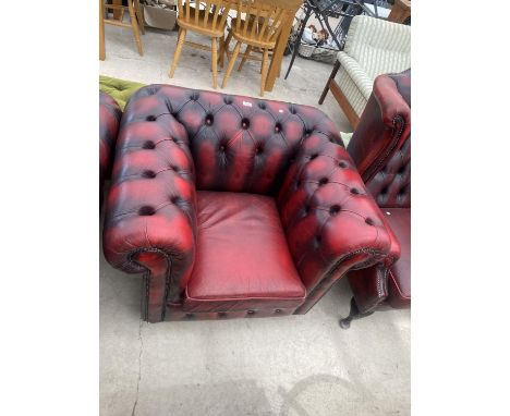 A MODERN OXBLOOD BUTTON-BACK CHESTERFIELD EASY CHAIR 