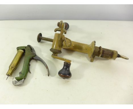 TWO EARLY 20TH CENTURY BULLET RE-LOADING TOOLS, ONE MARKED JAMES DIXON 