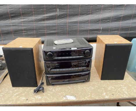A KENWOOD STEREO SYSTEM WITH AMPLIFIER, COMMAND UNIT AND CASSETTE DECK WITH TWO WOODEN CASED SPEAKERS 