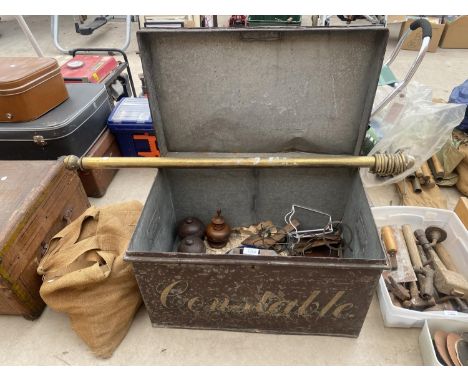 A LARGE METAL STORAGE TRUNK WITH VARIOUS CURTAIN POLE FITTINGS 