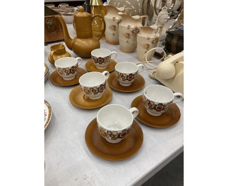 A RETRO COFFEE SET BY MYOTT TO INCLUDE COFFEE POT, CREAM JUG AND SIX CUPS AND SAUCERS 