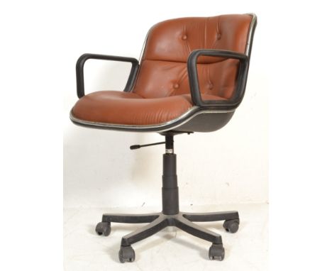 After Charles Pollock - A retro Italian executive type swivel desk chair having a black plastic moulded shell seat, button ba