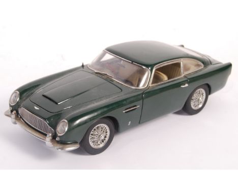 An original Autoart 1/18 scale diecast model Aston Martin DB5 in British Racing Green. Model appears in good displayed condit