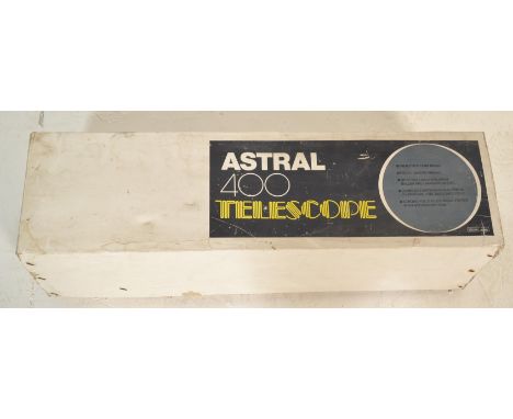 A boxed Astral 400 telescope finished in blue having retractable wooden tripod stand. Appears complete with lenses in origina