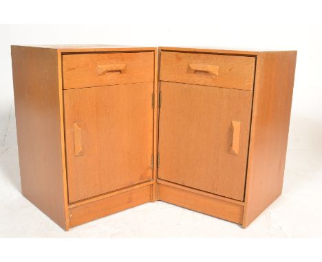 Stag - A pair of retro 20th Century light oak bedsides having a single drawer above a single door cupboard with both having a