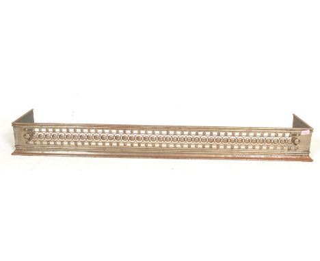 A late 19th Century Art Nouveau fire fender, fret pierced with geometric design throughout, remains of original chrome finish