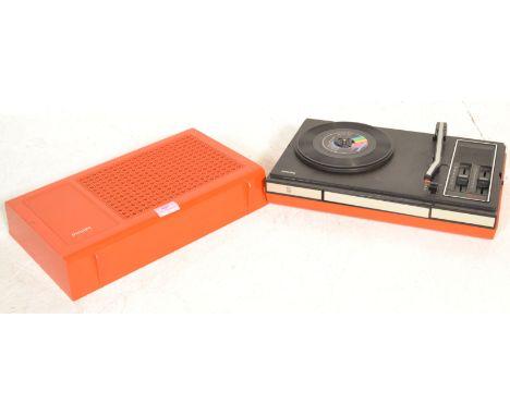 A vintage 1970's Philips 523 portable stereo design three speed record player turntable, having an orange case with a silver 