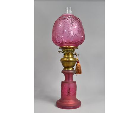 A Late Victorian/Edwardian Cranberry Glass and Brass Oil Lamp, The Cylindrical Base with Frosted and Vine Decoration, Similar