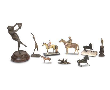 A Hagenauer style brass figure of female golferlacking club; a brass figure of a naked woman catching a ball; a figure of a j