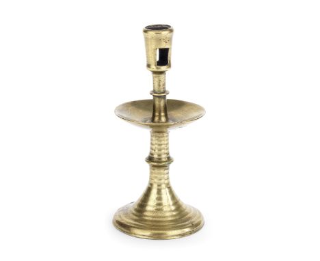 An early copper alloy Heemskirk-type candlestickNorth West European, 16th centuryThe shaft with central drip pan dividing two