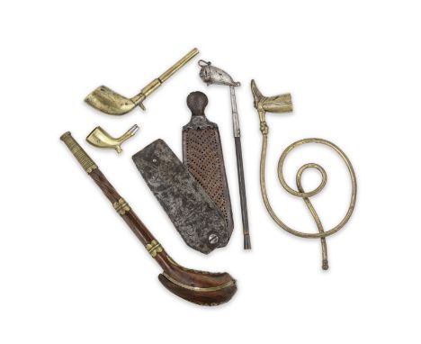 An engraved steel snuff grater together with a collection of pipes and a walnut and brass pipe case18th and 19th century The 