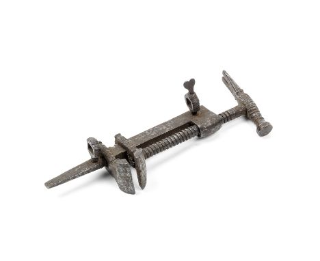 A rare combination tool probably relating to antique firearmsLate 16th/17th centuryOf russet iron, comprising a clamp operate