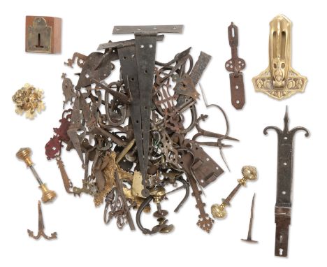 A collection of door furniture18th century and laterIncluding early examples of handles, knobs and key escutcheons, ironwork 