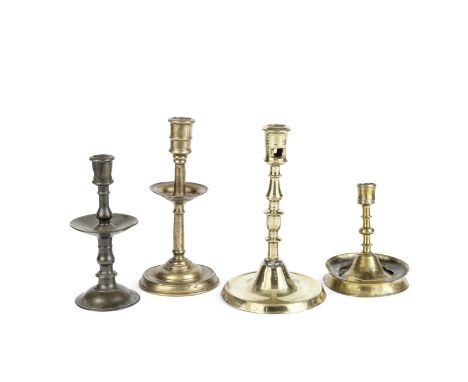Four copper alloy candlesticks15th to 17th centuryThe first North West European with multi-knopped stem and circular moulded 