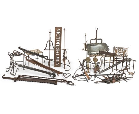 A large group of kitchen range utensils17th century and laterIncluding a foliate and initial engraved  steel hanging bracket,