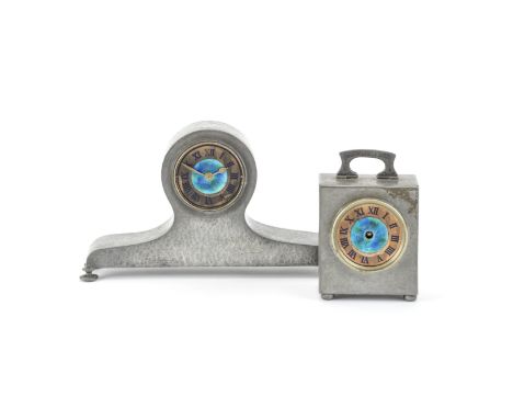 A Liberty &amp; Co Tudric pewter and enamel timepieceCirca 1903The Rectangular case with shaped hinged handle above a circula