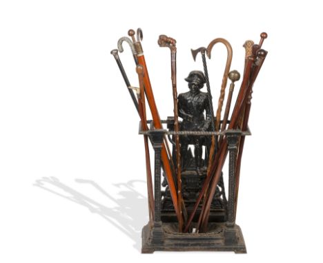 A 19th century cast iron stick stand commemorating NelsonTogether with an oak art deco stick stand, a 19th century circular y