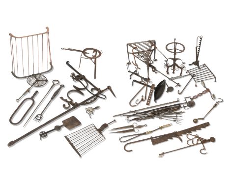 An iron fire range bracket and fireside itemsThe bracket with scroll support; a triangular steel trivet; two further trivets;