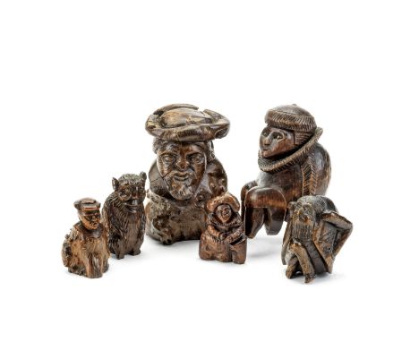 A collection of three carved root wood figures, a figural snuff box and two nut crackers19th century The nutcrackers in the f