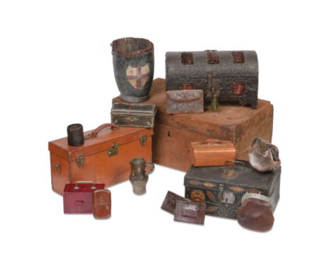 Leather and other trunks and boxesTo include an embossed iron covered wooden casket; a leather and studded  box; a leather bu