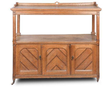 A late Victorian light oak buffet with aesthetic motifsWith an open shelf and cupboards below; together with a walnut dwarf b